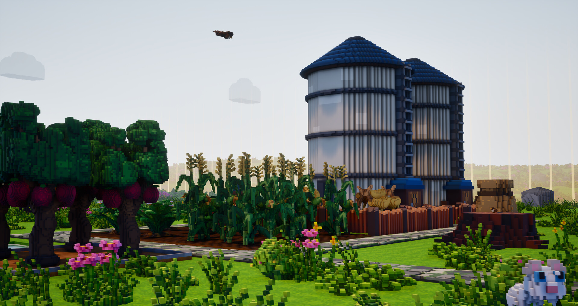 Orchard trees and a grain silo in the farm landscape.